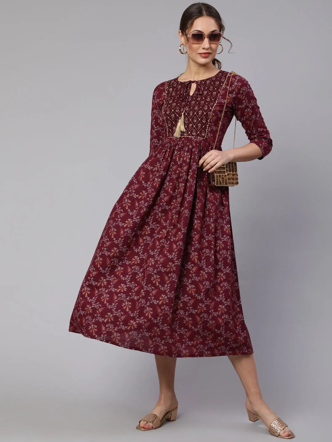 Wome Burgundy Printed Flared Dress With Three Quarter Sleeves