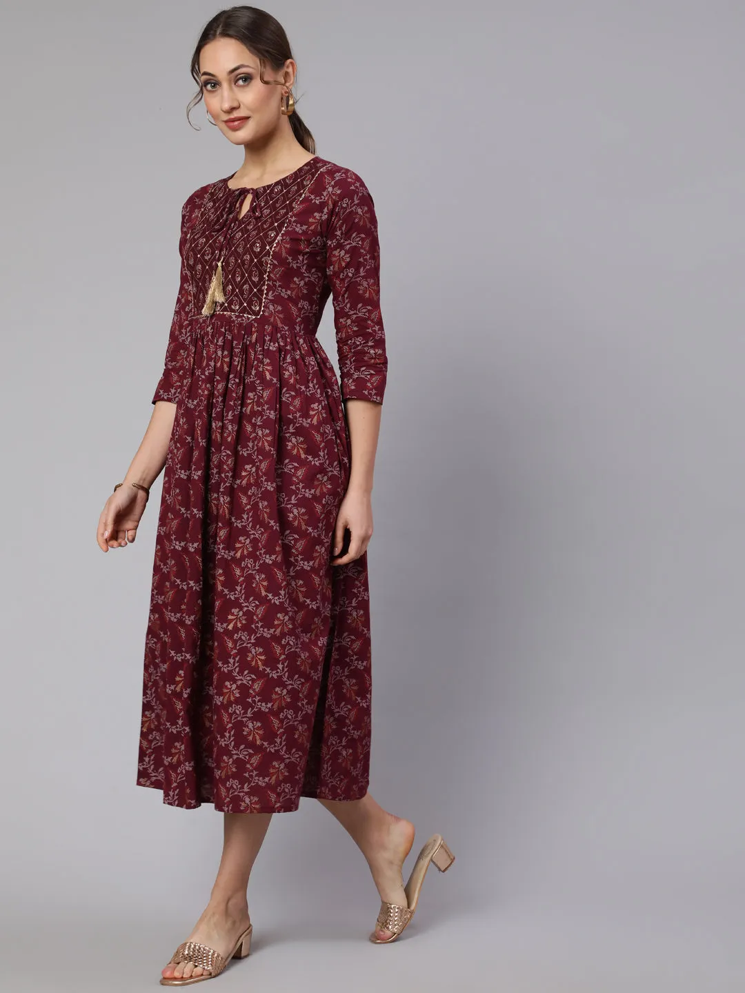 Wome Burgundy Printed Flared Dress With Three Quarter Sleeves